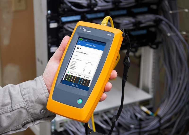 Technician Holds a Fluke Networks’ LinkIQ Cable + Network Tester